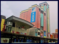 A pink/yellow skyscraper complex, a shopping mall and a cinema complex at Zhongshan Road.